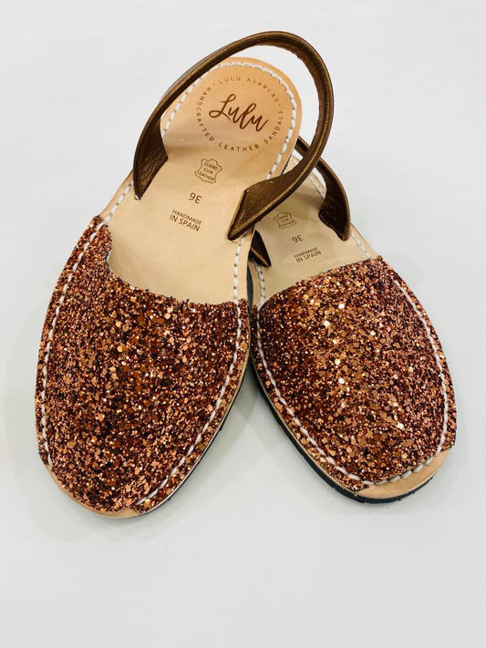 LULU AVARCAS LEATHER SANDAL IN COPPER GLITTER