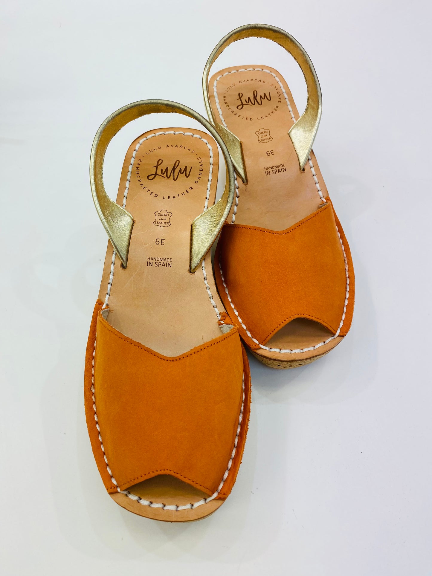 LULU AVARCAS CORK WEDGE IN ORANGE WITH GOLD STRAP