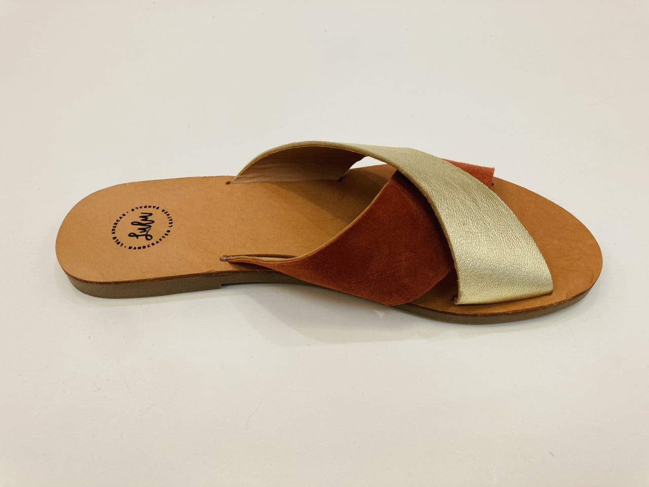 LULU AVARCAS CROSS OVER LEATHER SLIDE IN RUST AND GOLD